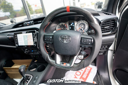 Toyota Hilux GR Sport Carbon Steering Wheel with Flat Base & Red Stripe